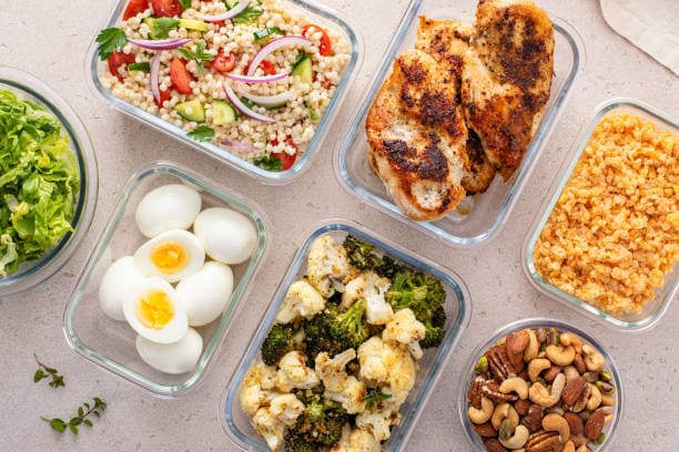 Meal preparation service cooking a healthy meal in a home kitchen